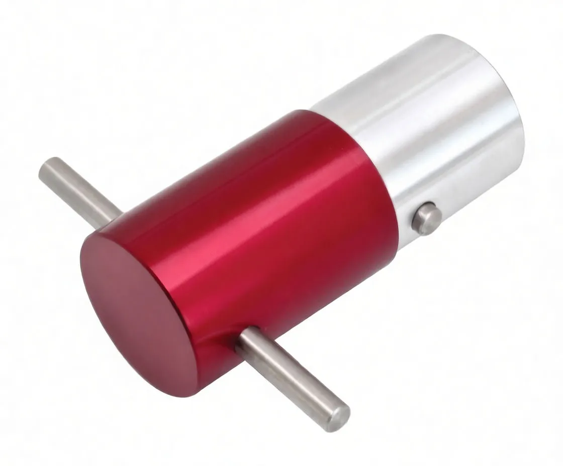 Top-right oblique view of red ASTA axle alignment cylinder with silver sleeve, two metal locator rods and a small set screw