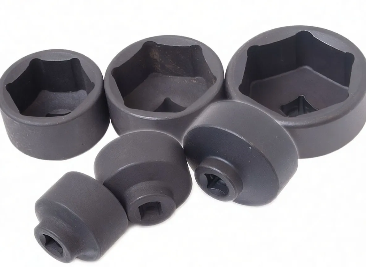 Close-up of six black ASTA A-268 impact sockets and an adapter showing 6-point interiors, square drives, and white brand markings