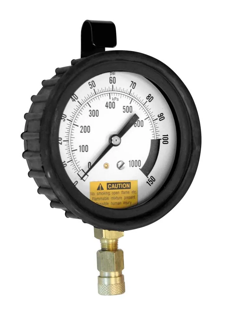 Close-up of a fuel injection pressure gauge: white dial with psi/kPa scales, black rubber housing, brass connector below and yellow caution sticker on face.