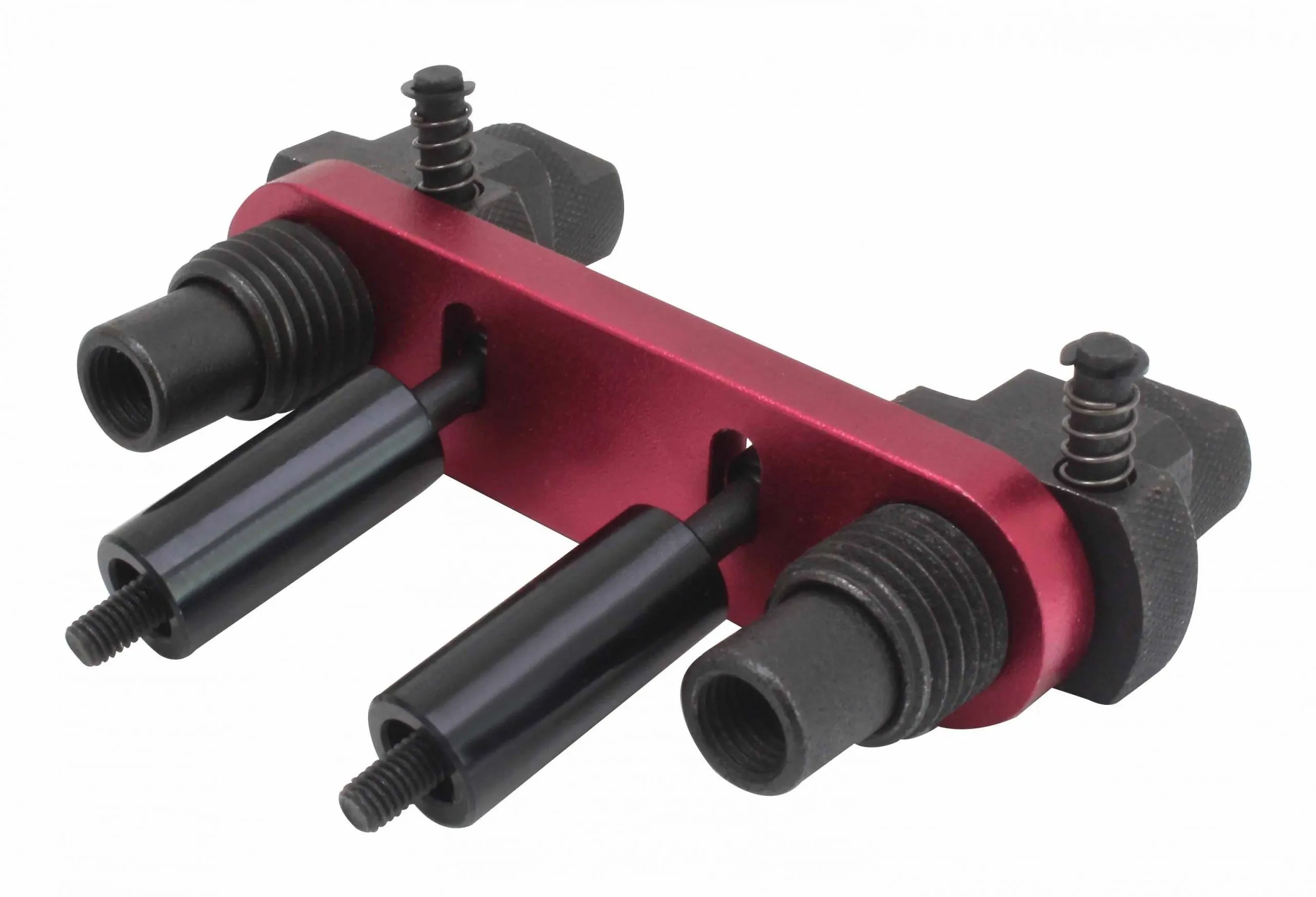 Underside view of red plate tool with three black extraction studs and threaded collars