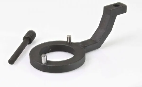 Side view of a black ring-style fuel pump holding tool with two dowel pins, offset arm and separate knurled locking pin.