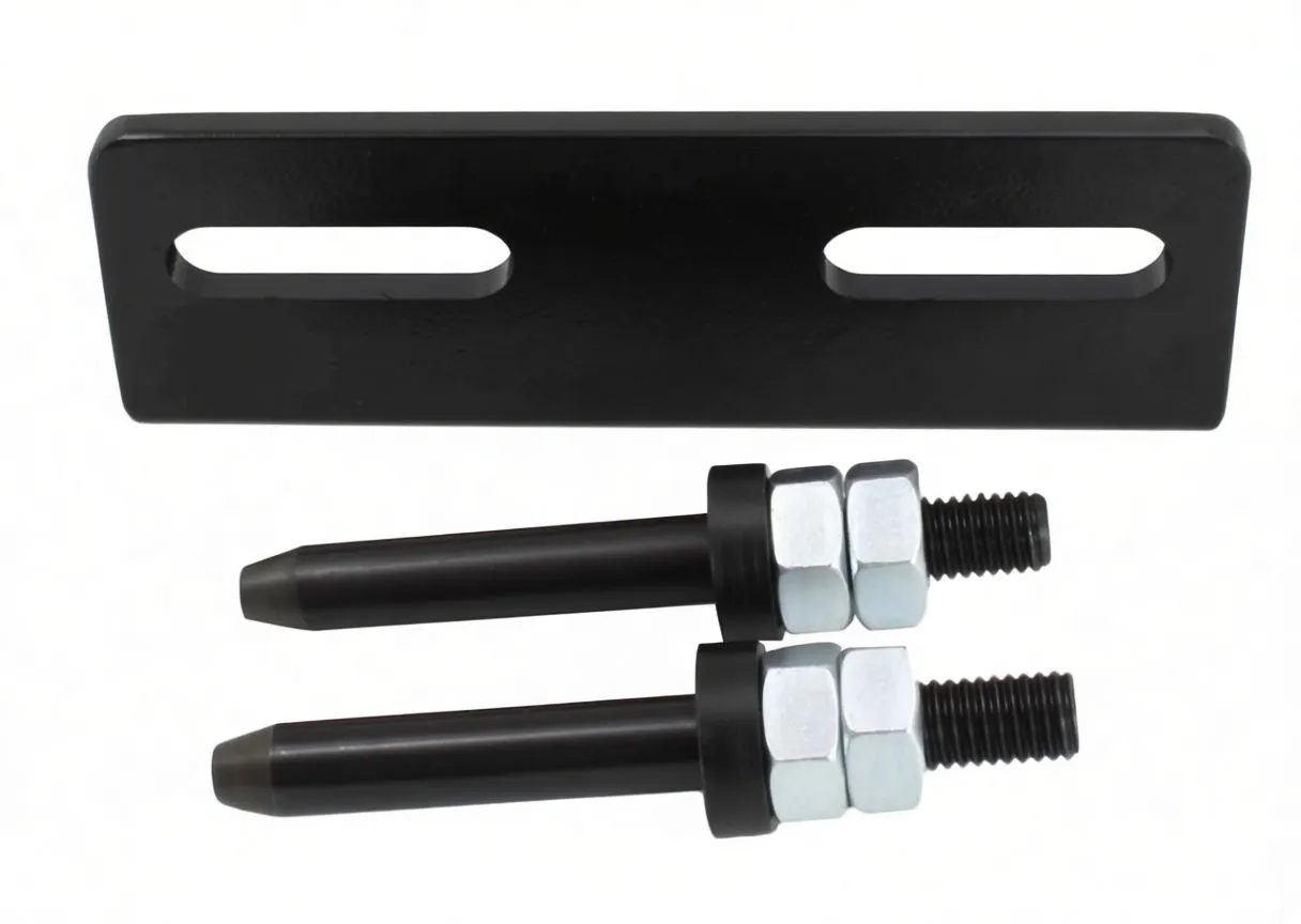 Top view of flat black bracket with two long slots above two parallel tapered guide pins with hex nuts