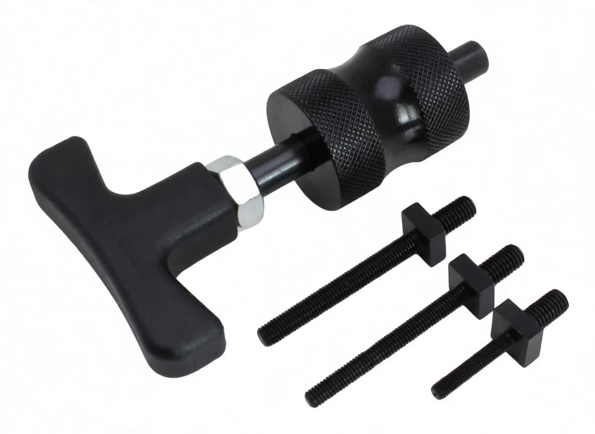 Close-up of T-handle puller tool with knurled metal cylinder and three threaded bolts with square collars