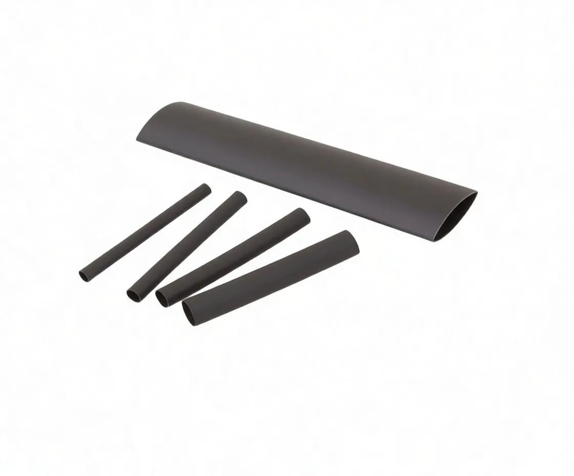 Close-up of black heat-shrink tubing pieces with white printed size markings including 'A-THERM127' and diameter/length codes
