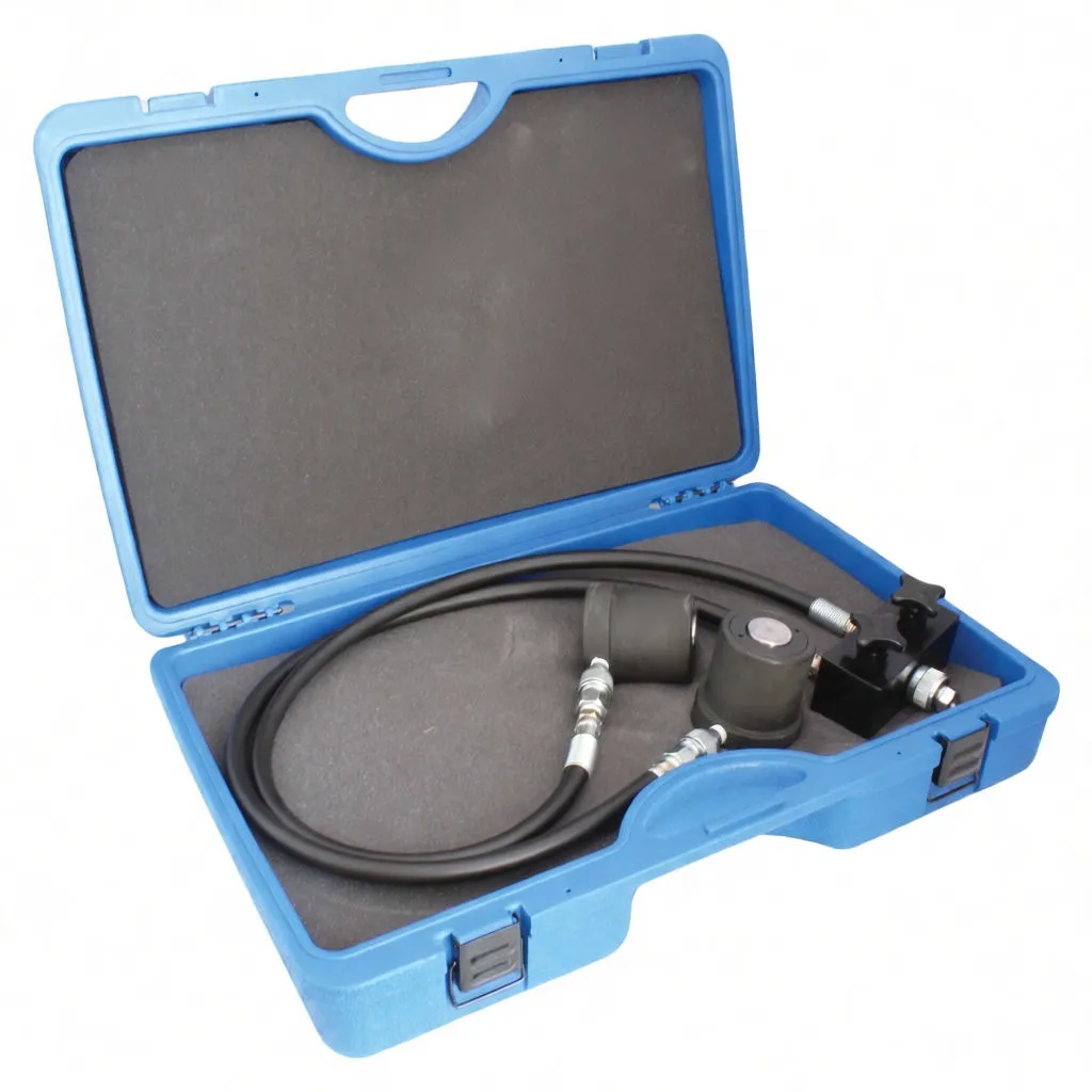 Angled view of open blue case with hydraulic hoses, two cylinder rams and a black adapter block