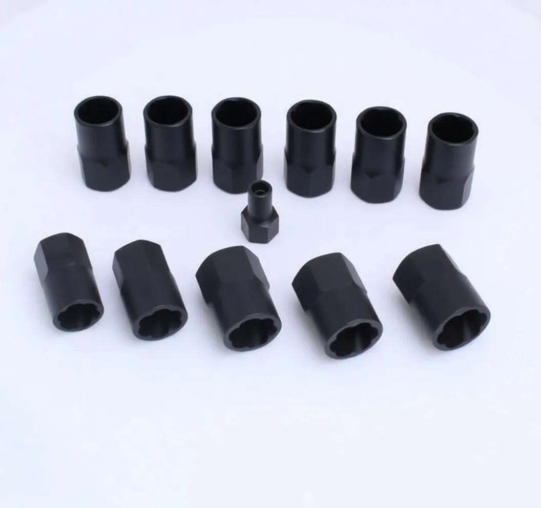 Disassembled bolt extractor sockets, adapter piece and steel rods arranged on a light background