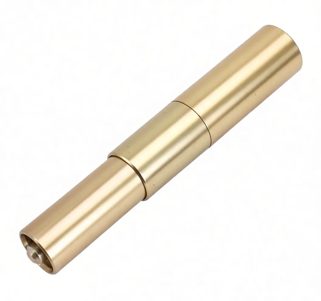 Side view of large multi-valve tool with black foam grip and gold metal sleeve showing printed logo and open tubular end.