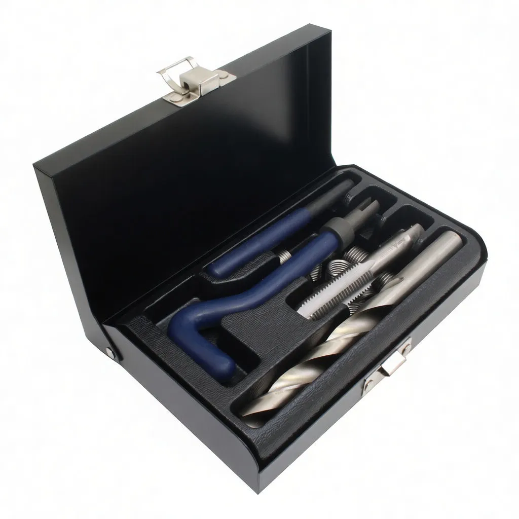 Angled view of open thread repair kit in black metal case showing drill, taps, coiled inserts and blue L-shaped handles