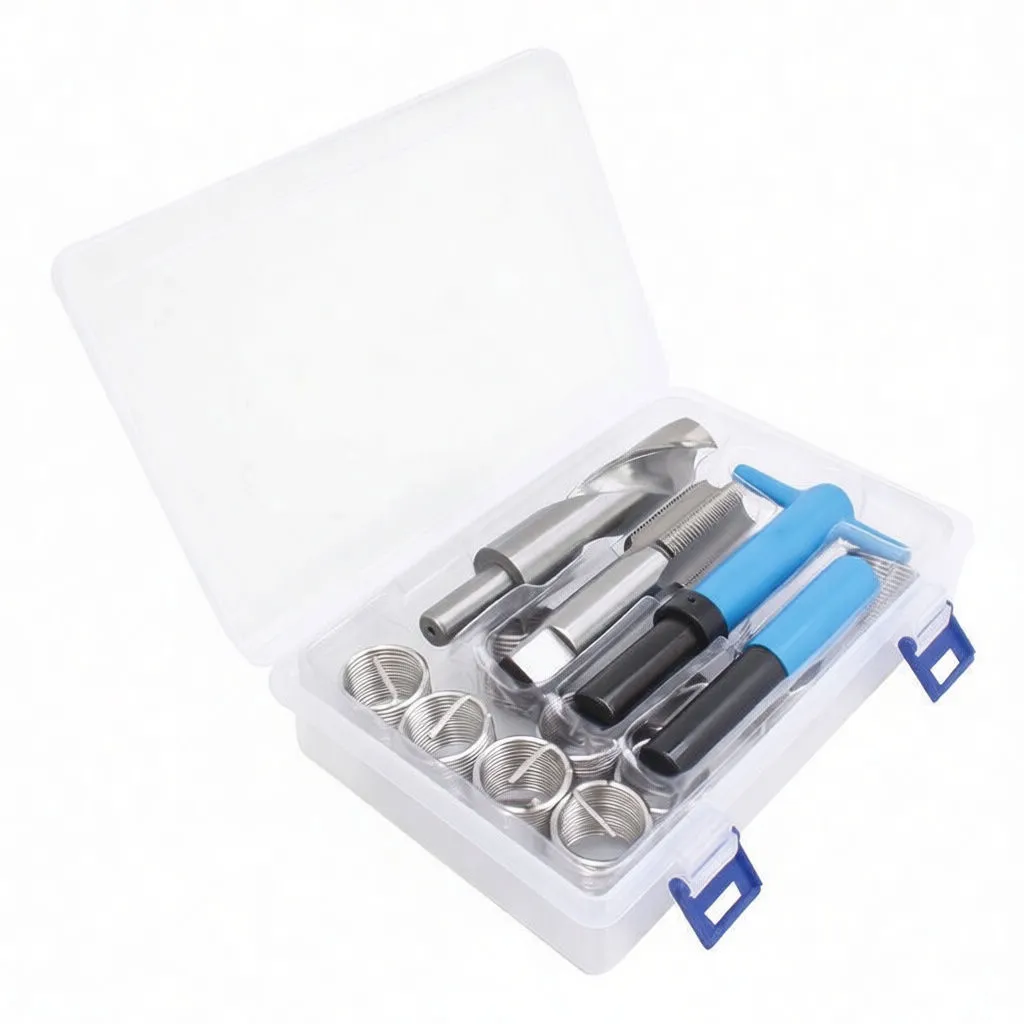 Angled open case showing coil inserts, drill, tap and blue-handled insertion tools in molded plastic tray