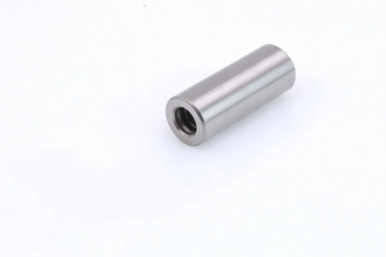 Angled view of magnetic bit holder showing black hex shank, hex tip and stamped markings on silver sleeve