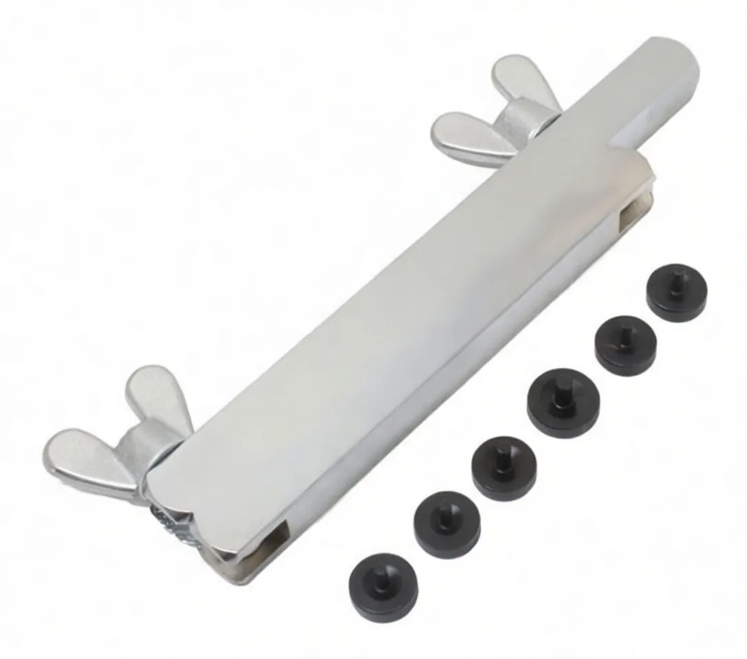 Top-down angled view of clamp showing engraved sizes and black adaptor plugs