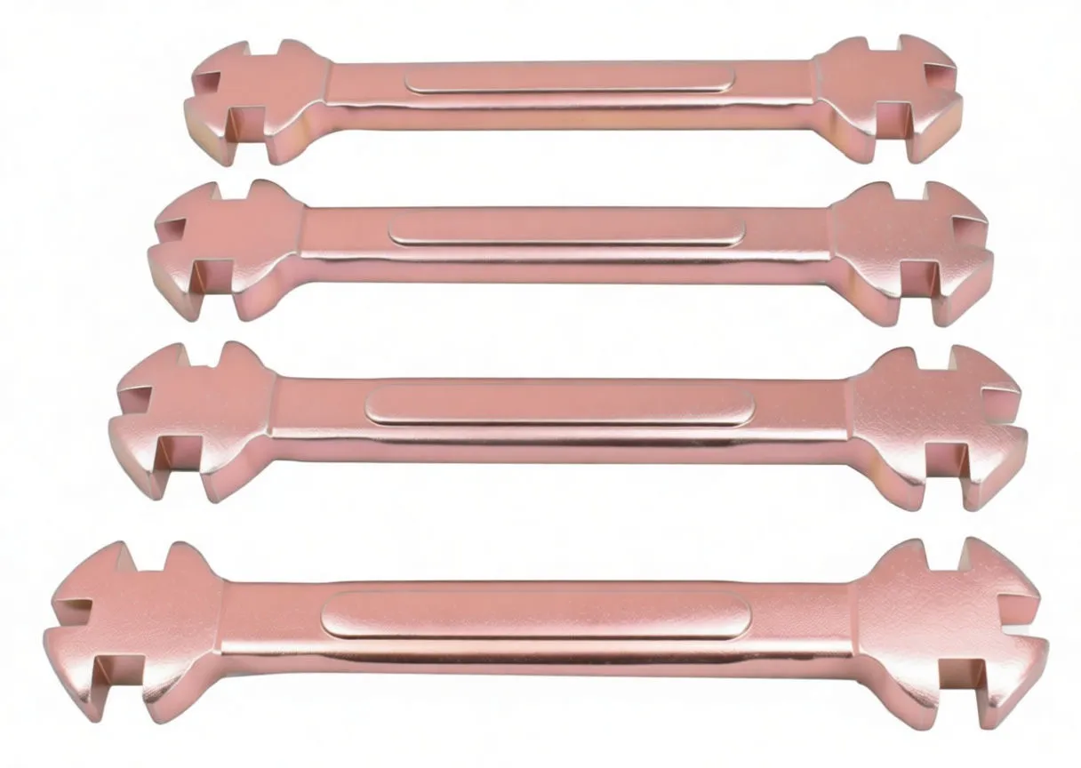 Parallel arrangement of four plated spoke wrenches showing notched cross-shaped ends and stamped size numbers.