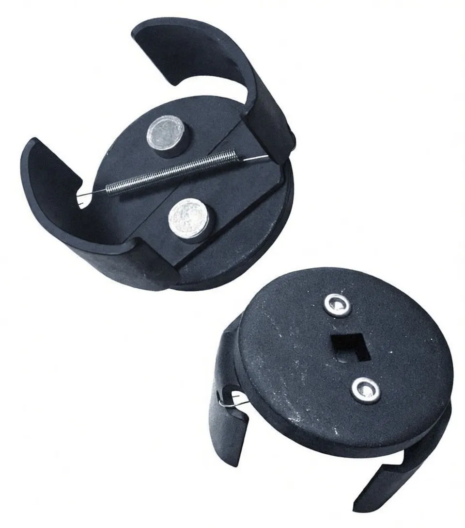 Two oil filter wrenches: one showing underside with spring and anchor posts, the other showing top with square drive recess and two rivets.