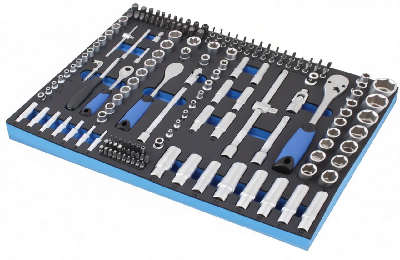 Angled view of a foam-lined tool module with chrome sockets, extensions and two blue-handled ratchets, ASTA logo visible.