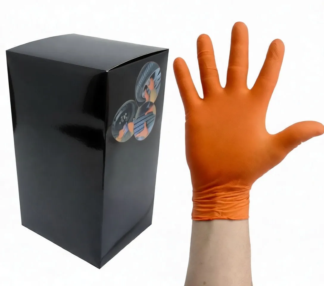 Close-up fist wearing orange nitrile glove in front of SaTra S-S9GYD box showing 100 pieces label