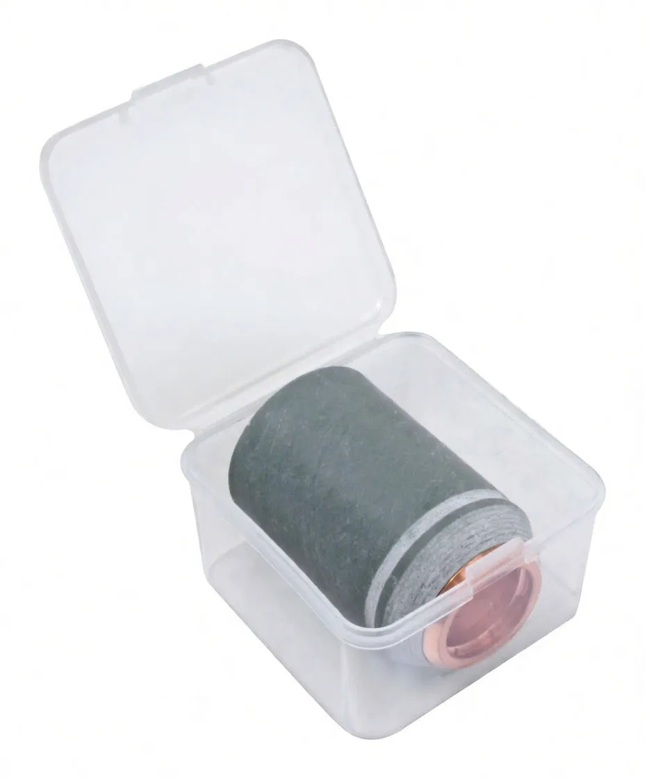 Welding nozzle cover stored in a clear plastic box with a printed label and barcode visible on the lid.