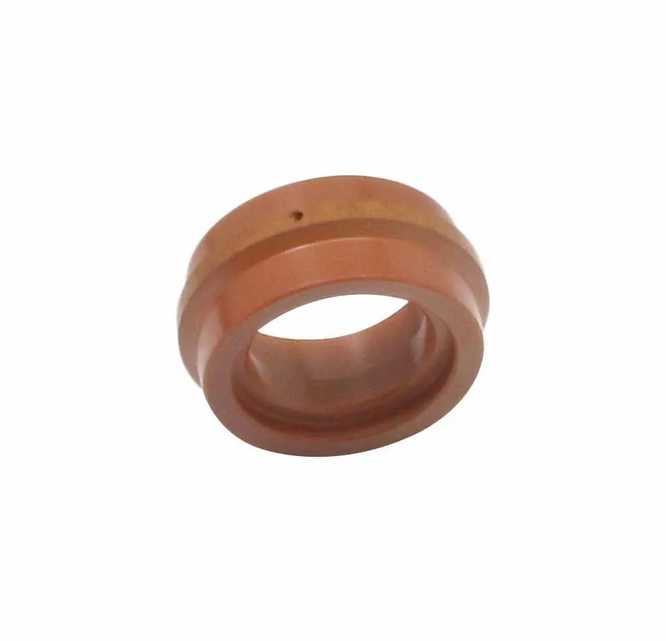 Tilted overhead view of copper-colored plasma welding nozzle ring with stepped bore and small hole