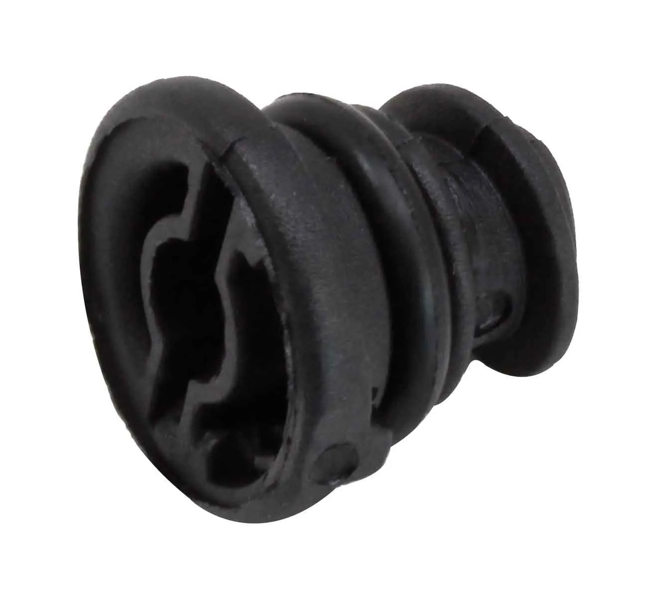 Underside view of black plastic drain plug revealing a multi-lobed internal cavity, retention clips and stepped outer rings.