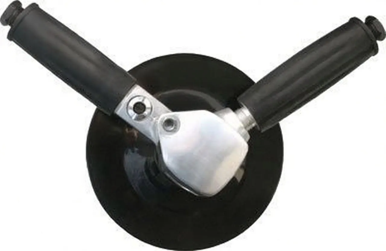 Top view of a disc sander showing black sanding pad, V-shaped black handles, metal housing and visible labels on pad and handle end.