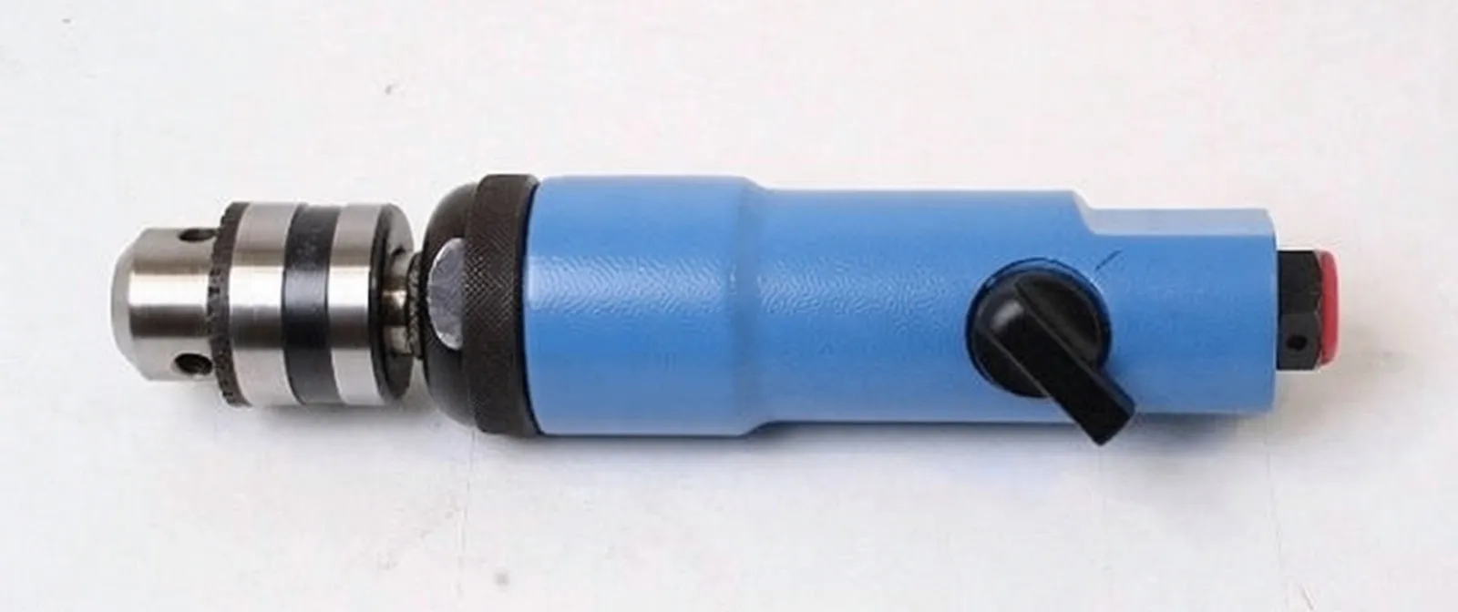 Top-side view of pneumatically powered A-350 drill showing spec label, selector knob, throttle lever and keyed chuck