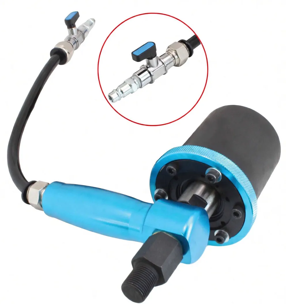 Close angle of pneumatic hammer head, visible brand marking on cylinder, hose with quick-connect and shut-off valve