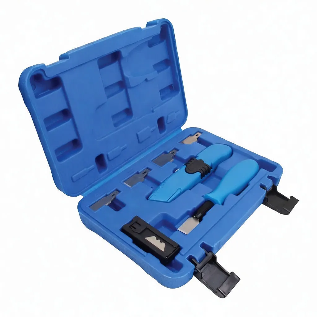 Close-up of retractable knife, scraper and multiple interchangeable blades in blue case