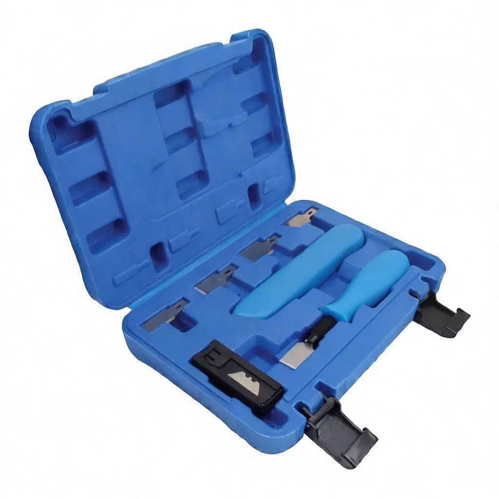 Flat arrangement of scraper, utility knife, blade cartridge and many replacement blades