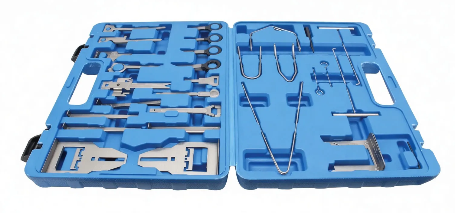 Overhead wide view of an open blue case with numerous metal radio unlocking tools: wire hooks on one side and flat plate extractors on the other.
