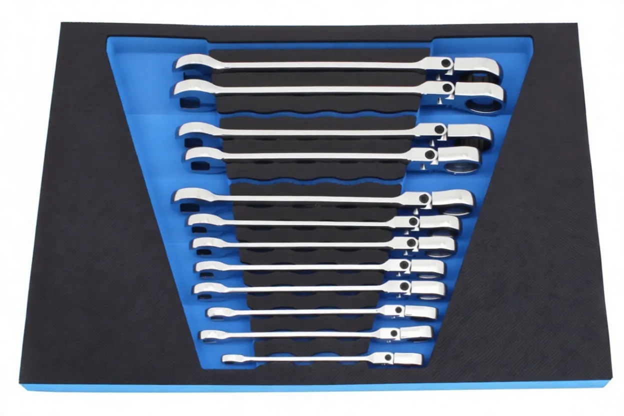 top-down view of triangular foam insert with chrome ratcheting wrenches in blue cutouts and ASTA branding