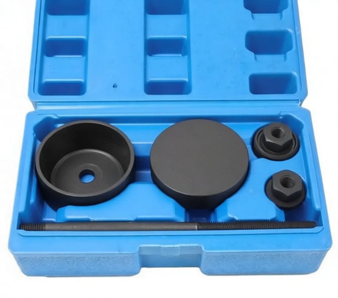Close view of black pressing cups and flat plate with white marking, hex adapters and threaded rod in blue molded case.