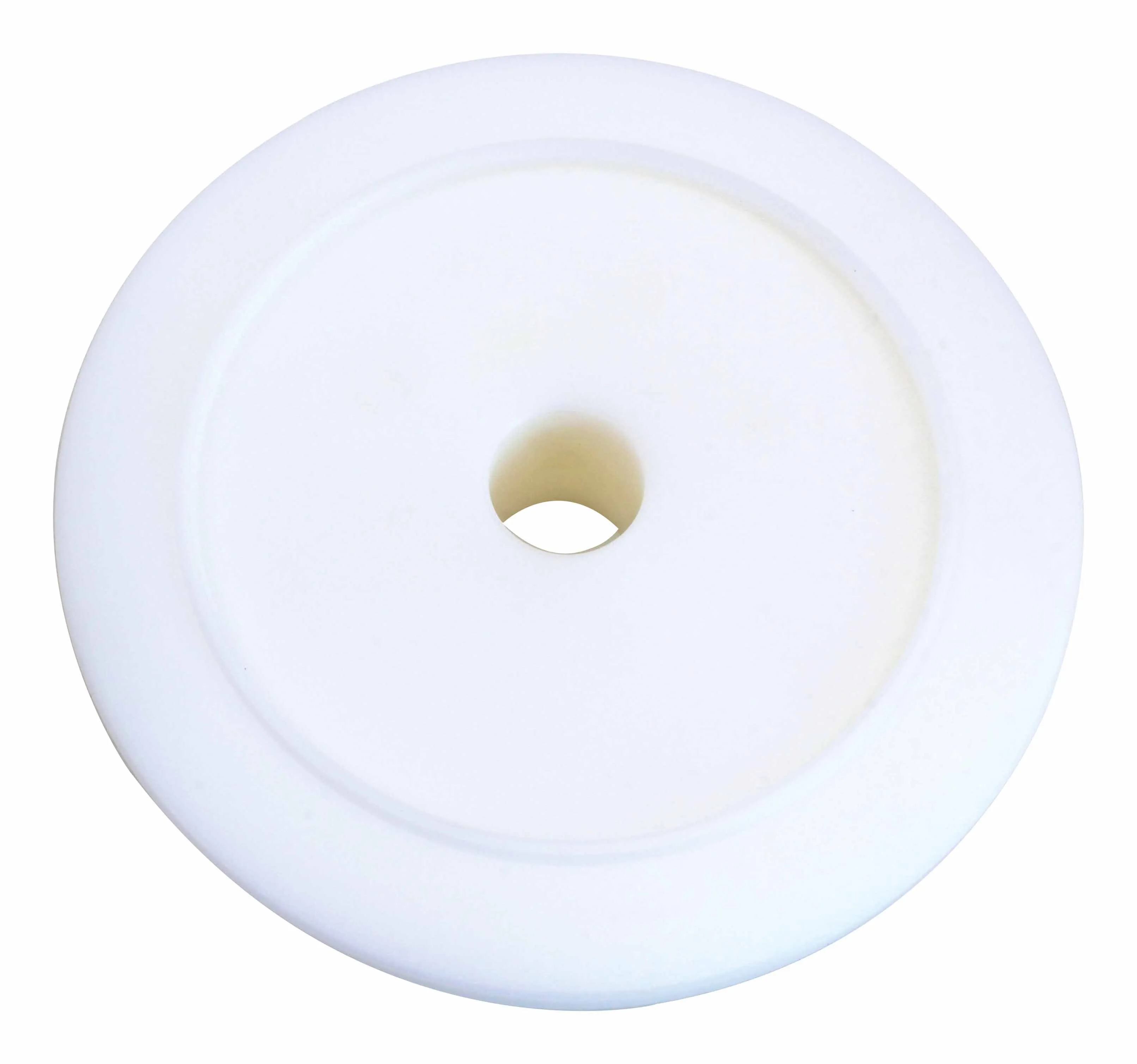 Bottom view of round plastic installer with central hole and plain smooth face