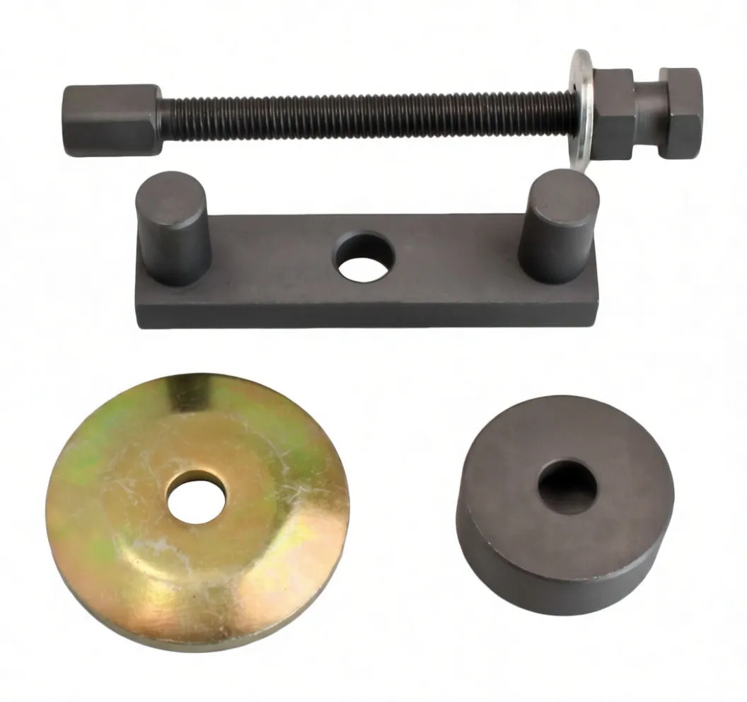 Close-up of threaded bolt, locating plate with two pins, zinc press disc and cylindrical adapter all marked 'satra'