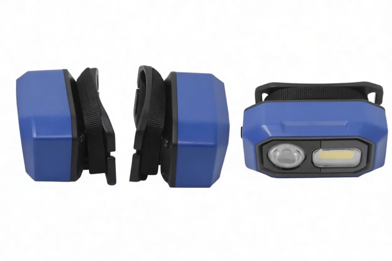 Gloved hand holding headlamp switched on with bright beams from spot and COB, strap hanging down