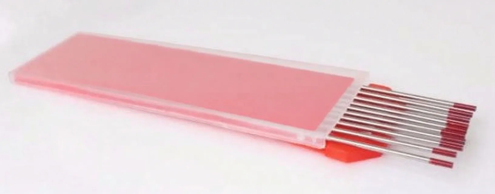 Angled view of a red plastic sleeve with several silver welding rods with red tips partially slid out and label with barcode visible.