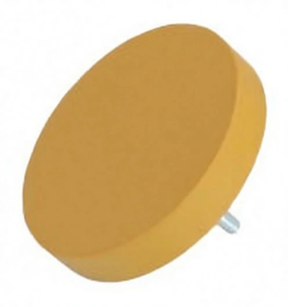 Angled view of yellow rubber eraser pad showing metal threaded stud and oval embossed brand/model marking on the face