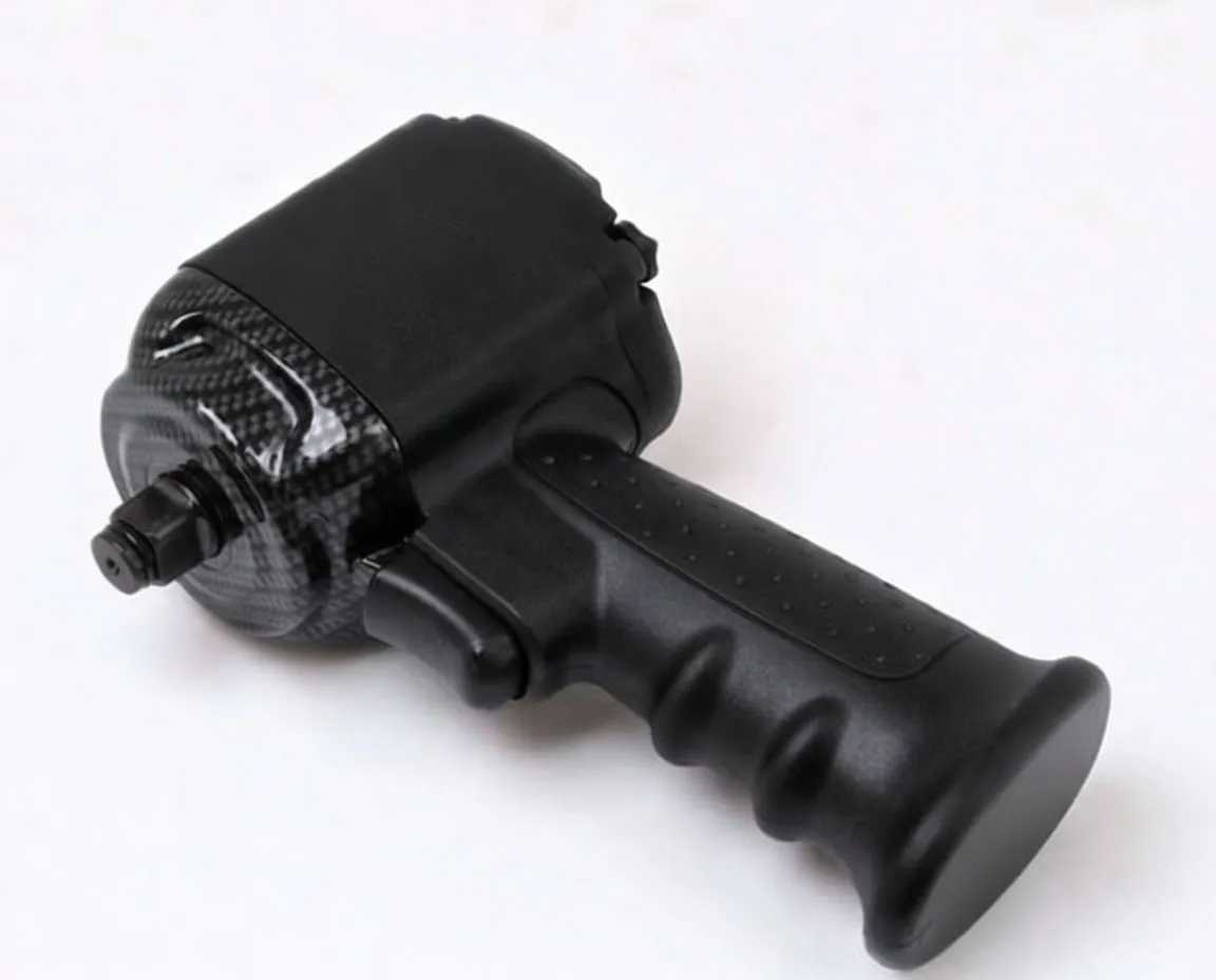 Angled view of black composite air impact wrench showing textured grip, carbon-fiber dome, anvil and brand embossing
