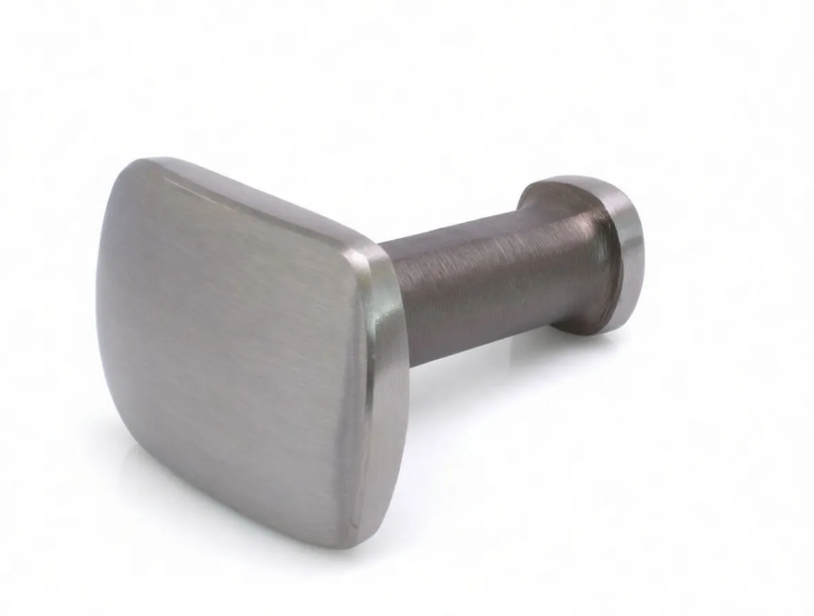 Brushed stainless meat tenderiser laying on its side showing square pounding face, brushed handle with barcode label and round butt flange.