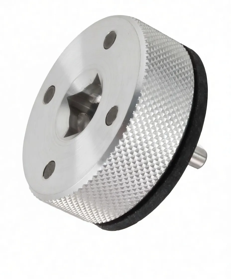 Perspective view of steering stem nut tool showing engraved logo on face, central engagement recess, knurled body and rubber gasket