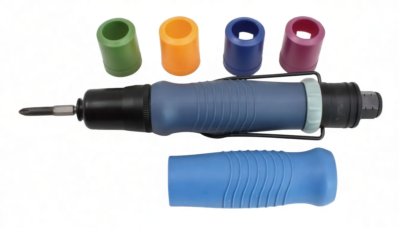 Top-down view of straight pneumatic screwdriver, two bits, brass fitting and colorful caps