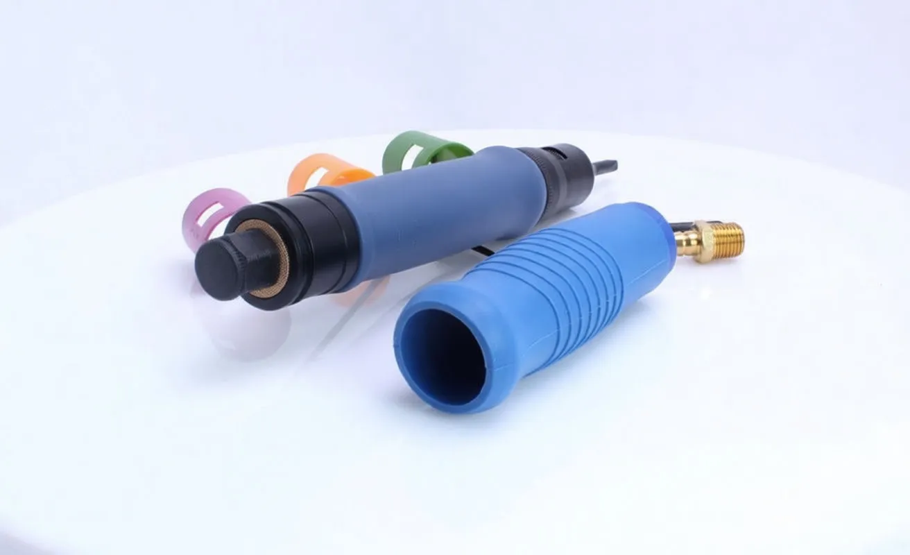 Disassembled straight pneumatic screwdriver showing removed blue sleeve, rear knurled knob with 'TYPE A' label, and brass air connector.