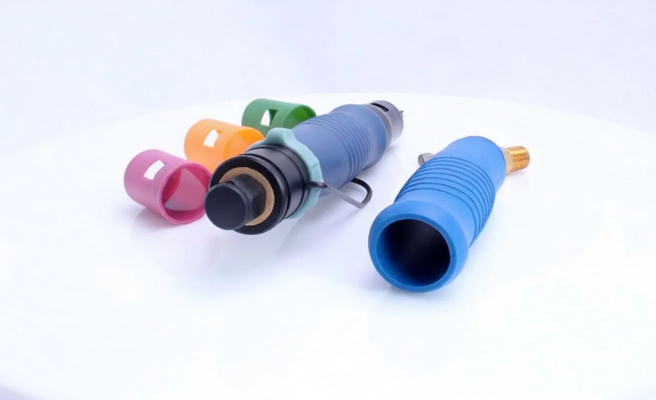 Disassembled pneumatic screwdriver showing blue grip sleeve removed, brass air inlet, foam exhaust, colored caps and white specification label.