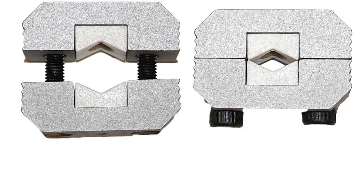 Two silver V-grooved clamp jaws shown separated and assembled, joined by black screws to form a square block with a diamond center.