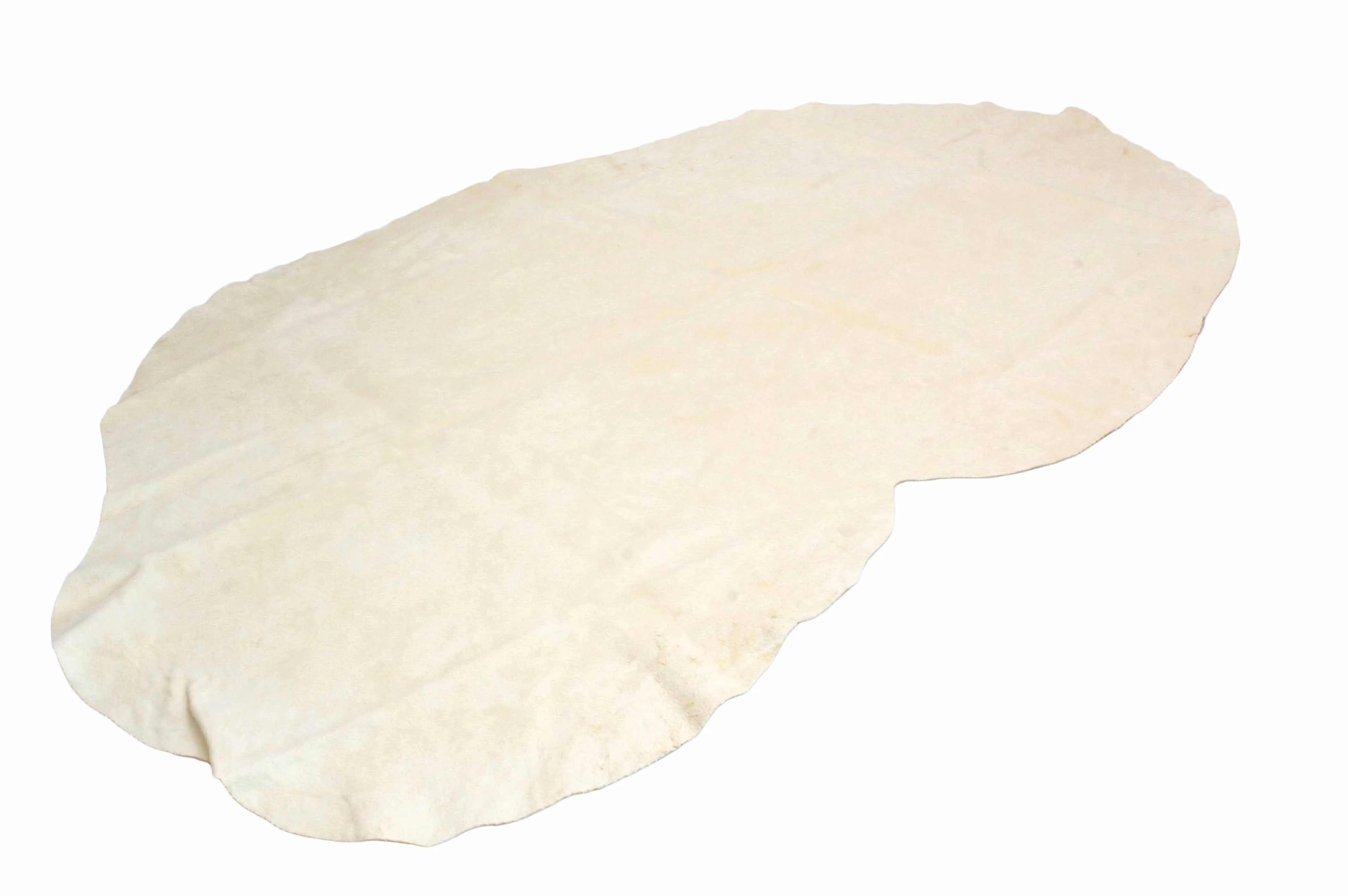 Opened chamois laid flat, irregular hide shape and cream suede surface
