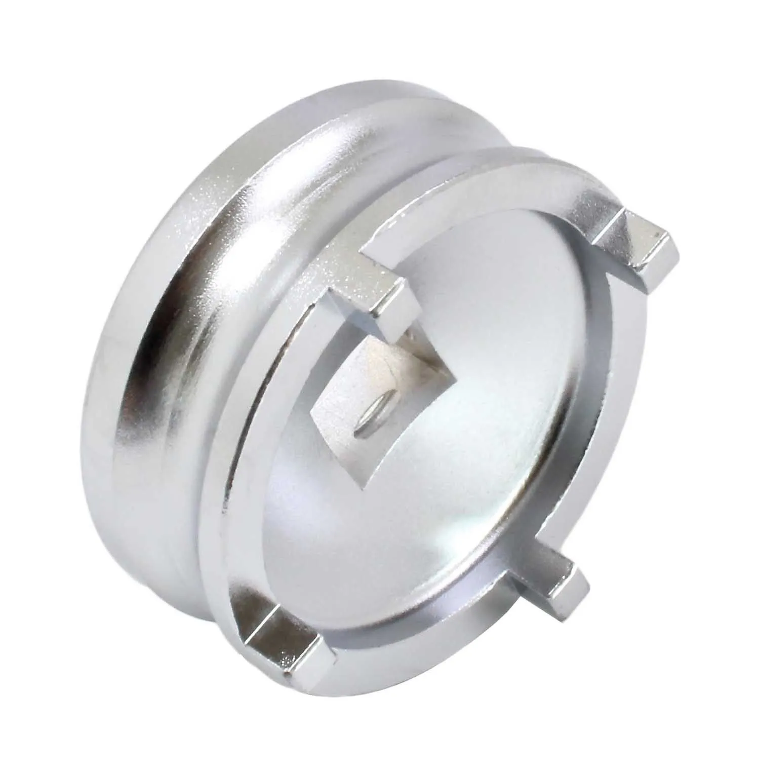 angled view of silver lock nut tool showing four lugs and central square drive inside a recessed cup