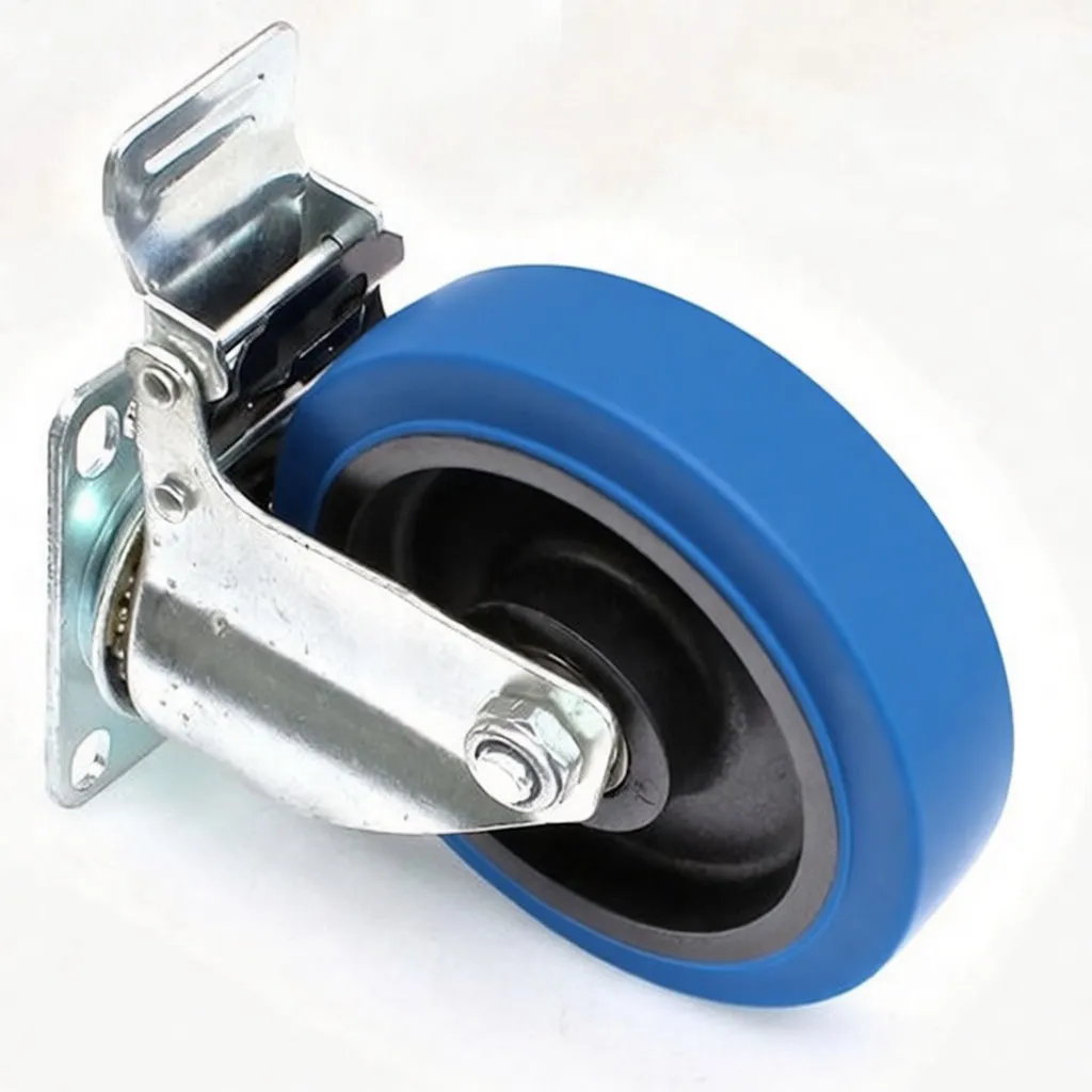 Angled side view of blue rubber-tired caster with zinc-plated swivel fork, four-hole mounting plate and visible brake lever and stamped marking