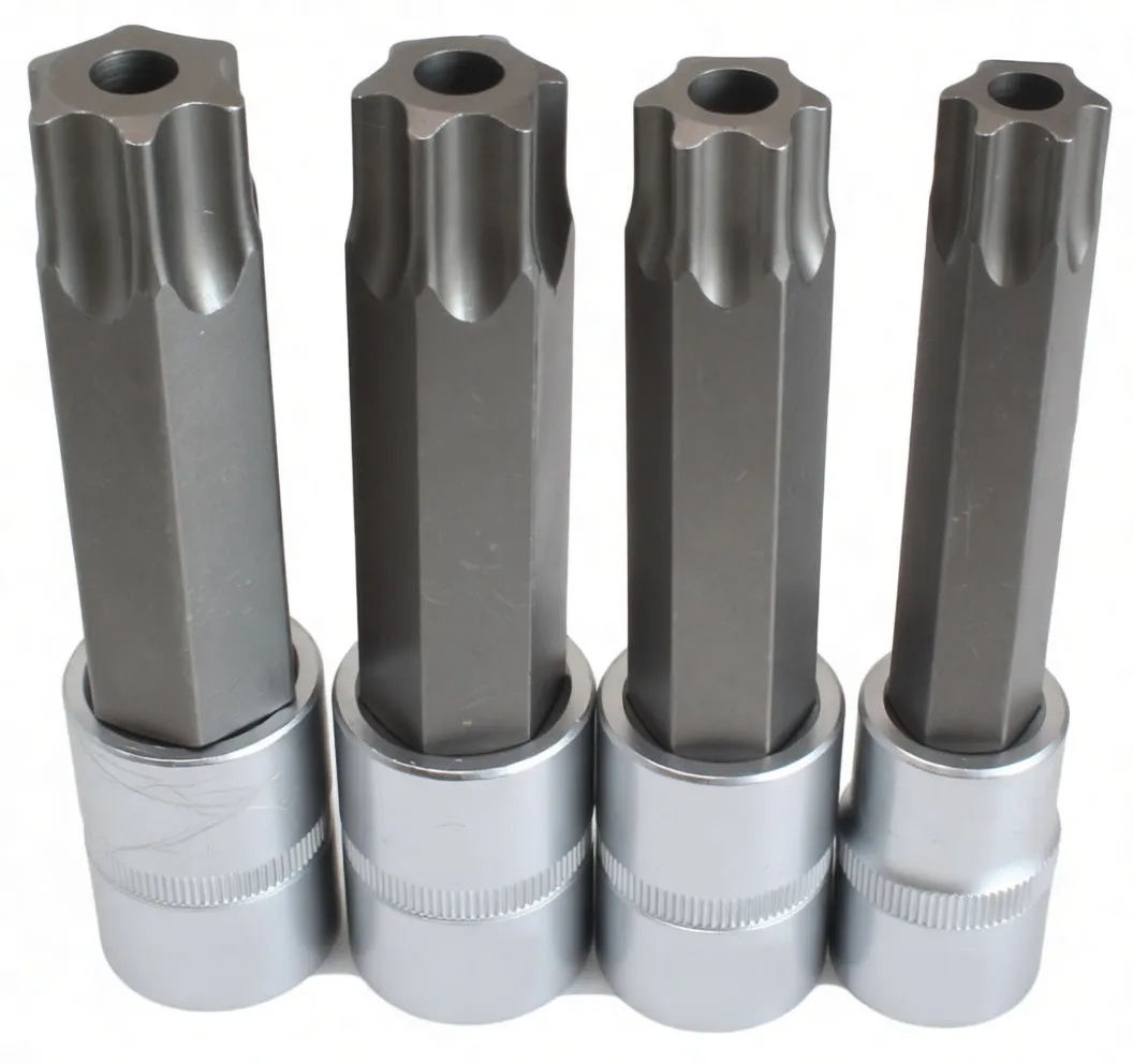 Four tamperproof Torx socket bits standing upright showing star tips with center pin holes and chrome 1/2" drive bases