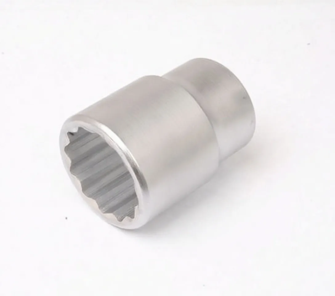 Angled shot of short chrome 12-point socket showing internal profile and drive shank hole