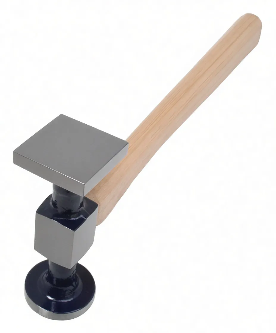 Close-up of hammer head focusing on square textured face, collar with wooden wedge and round striking face.