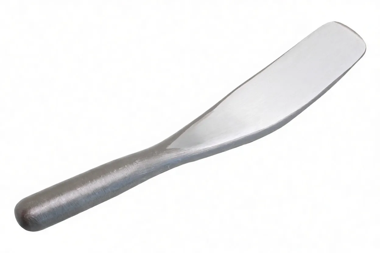 Full-length tinsmith's spoon showing ASTA LDP122 marking and rounded handle