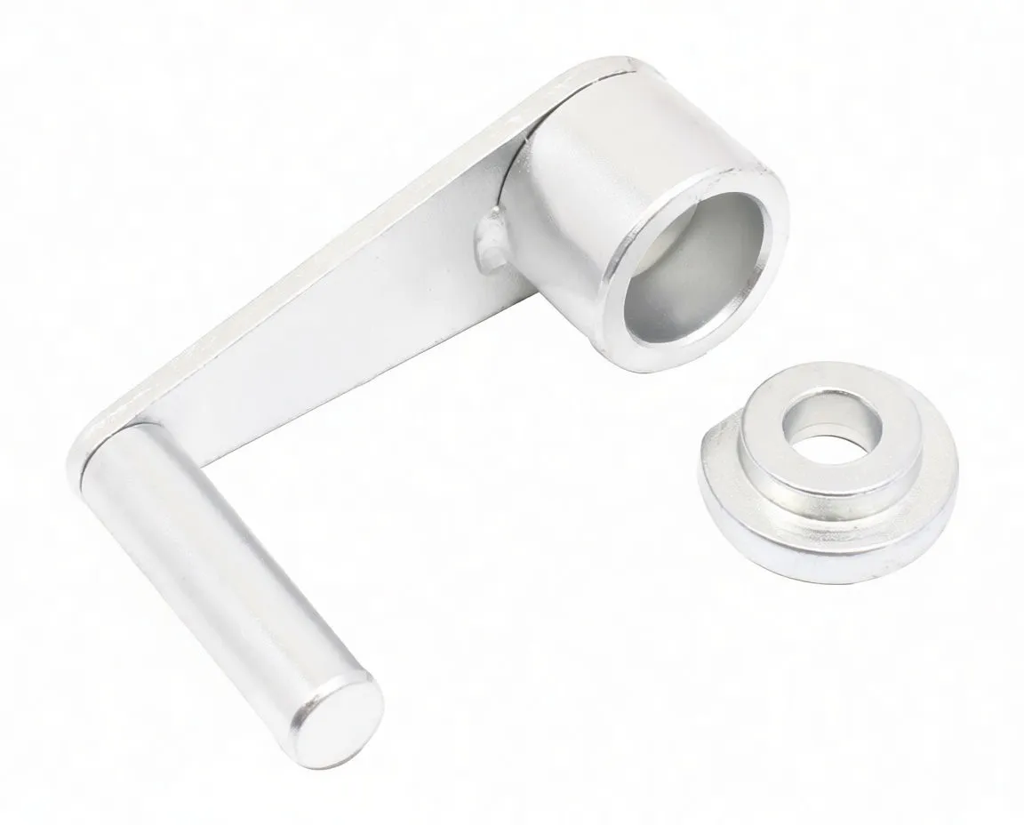 Angled view of silver belt tensioning tool with horizontal peg, hollow cylindrical socket showing faint stamped markings, and stepped adapter beside it.